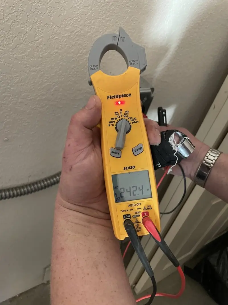 Voltage testing with clamp meter during Recessed Lighting Installation in Irvington
